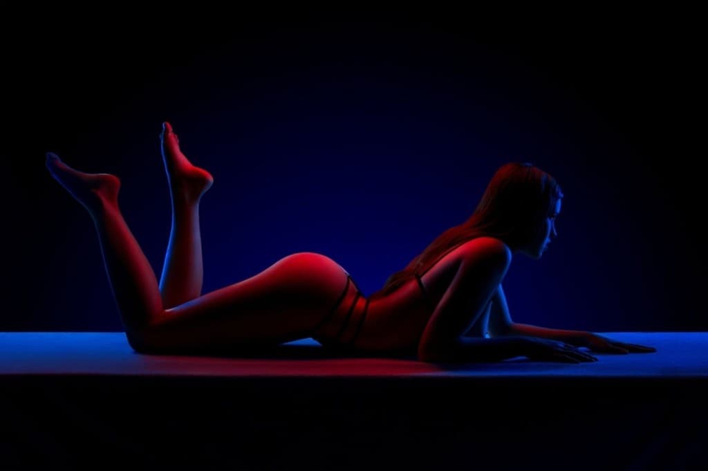 Warm oil bodywork across the back during signature flow massage